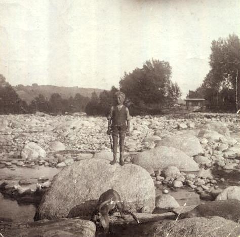 Young Guido Deiro playing with his dog at the River Orco.