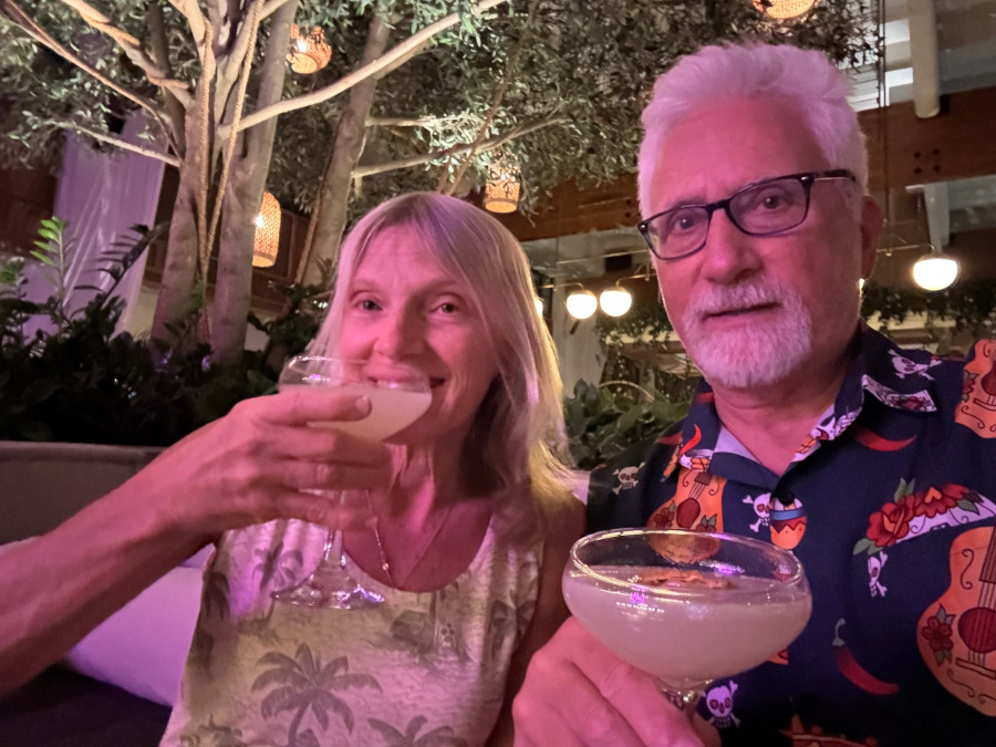 Cindy & I sip a Green Bird, a signature cocktail with gin, green Chartreuse, lime juice and vanilla/kiwi flavored liqueur, at the Canal Club.